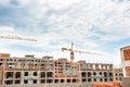 High buildings scaffold with crane at the construction site, top view Royalty Free Stock Photo