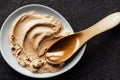 High-calorie protein peanut butter in bowl with spoon