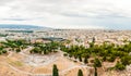 High cityscape view from Acropolis hill with ruined amphitheater and national museum on foreground