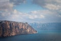 High cliffs over the sea under a blue sky with clouds. Fiolent.