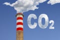 High concrete chimney emits CO2 into the atmosphere - concept image