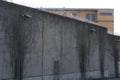 high concrete fence, barbed wire fence on top, building for execution of punishments for criminals, pre-trial detention, concept Royalty Free Stock Photo