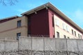 High concrete fence, barbed wire fence on top, pre-trial detention cell, building for execution of punishments for criminals, Royalty Free Stock Photo