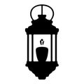 Black silhouette of a vintage lantern with a lit candle inside on a white background Royalty Free Stock Photo