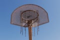 High contrast frontal image of metal basketball hoop backlit with sun flare, black and white Royalty Free Stock Photo