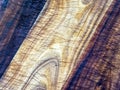 High contrast close-up view of a seasoned wooden kitchen cutting board