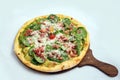 `A high contrast Hero shot of a Bruschetta Al Pesto Spinaci Pizza, on a minimal white background with a 60 degree angle from zoome Royalty Free Stock Photo