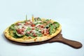 `A high contrast Hero shot of a Bruschetta Al Pesto Spinaci Pizza, on a minimal white background with a 30 degree angle from zoome Royalty Free Stock Photo