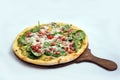 `A high contrast Hero shot of a Bruschetta Al Pesto Spinaci Pizza, on a minimal white background with a 60 degree angle from zoome Royalty Free Stock Photo