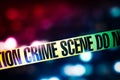 Crime scene tape with red and blue lights on the background Royalty Free Stock Photo