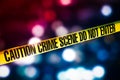 Crime scene tape with red and blue lights on the background