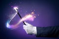 High contrast image of magician hand with magic wand Royalty Free Stock Photo