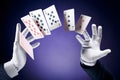 High contrast image of magician making card tricks Royalty Free Stock Photo