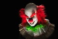 Scary clown on a dark background Royalty Free Stock Photo