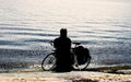 High contrast styled fisherman silhouette with retro bicycle on the beach Royalty Free Stock Photo