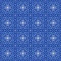 High contrasting seamless background tile with filigree white ornament on blue canvas. Vintage fabric style in damask design.