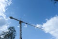 High crane in the cloudy sky Royalty Free Stock Photo