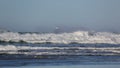 Crashing waves with decommissioned Tillamook Lighthouse along Oregon coast HD