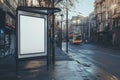 Blank billboard at a bus stop on a city street with a double-decker bus in the background Royalty Free Stock Photo