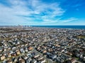 High drone aerial view of densely populated New Jersey shore towns by the ocean