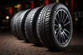 High efficiency summer tire set showcased in studio, dramatic lighting, shallow focus
