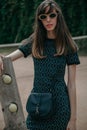 Stylish young tall girl on tennis court