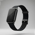 High-end image of a black smartwatch with black strap pin placed against a gradient backdrop Royalty Free Stock Photo