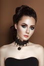 High Fashion Beauty Model Girl with collected brunette hair black corset and lace necklace Royalty Free Stock Photo