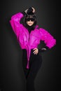 High fashion look. Glamour stylish beautiful girl model in colorful clothing isolated on black background. Beauty stylish brunette Royalty Free Stock Photo