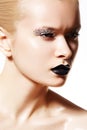 High fashion model. Silver make-up, black lips