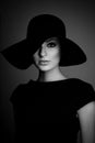 High fashion portrait of elegant woman in black and white hat an Royalty Free Stock Photo