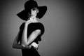 High fashion portrait of elegant woman in black and white hat an Royalty Free Stock Photo