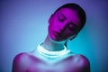 High Fashion woman in colorful bright neon uv blue and purple lights, posing in studio Royalty Free Stock Photo