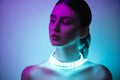 High Fashion woman in colorful bright neon uv blue and purple lights, posing in studio Royalty Free Stock Photo