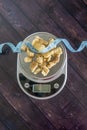 High fat low carb healthy snack - pork rinds measured on scale, measuring tape Royalty Free Stock Photo