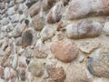 High fence of large boulders of stones reliably protects the estate Royalty Free Stock Photo