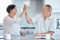 High five, tablet and senior couple in kitchen happy for success in online banking, ecommerce and internet. Love