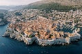 High fortress walls around stone houses in the old town. Dubrovnik, Croatia. Drone Royalty Free Stock Photo