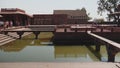 high frame rate clip of a pool and palace buildings at fatephur sikri