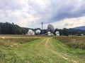 High frequency satellite dishes near a forest Royalty Free Stock Photo