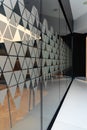 High glassy wall with small triangle stickers Royalty Free Stock Photo