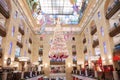 High Golden Christmas tree suspended from the ceiling in the Mall Children`s world. Moscow. 14.12.2018 Royalty Free Stock Photo