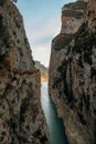 A high gorge of rocks and a mountain river. Deep narrow canyon along the river. Royalty Free Stock Photo