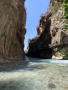 A high gorge of rocks and a mountain river. Deep narrow canyon along the river. Sights of Turkey, excursion for tourists.