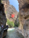 A high gorge of rocks and a mountain river. Deep narrow canyon along the river. Sights of Turkey, excursion for tourists.