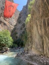 A high gorge of rocks and a mountain river. Deep narrow canyon along the river. Sights of Turkey, excursion for tourists.