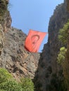 A high gorge of rocks and a mountain river. Deep narrow canyon along the river. Sights of Turkey, excursion for tourists.