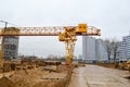 High heavy yellow metal iron load-bearing construction stationary industrial powerful gantry crane of bridge type on supports Royalty Free Stock Photo