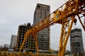 High heavy yellow metal iron load-bearing construction stationary industrial powerful gantry crane of bridge type on supports Royalty Free Stock Photo