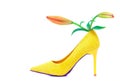 High heel shoe decorated with asiatic lily buds on white background Royalty Free Stock Photo